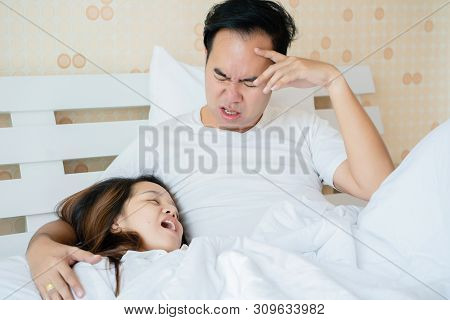 Snoring May Cause Apnea. May Cause Death. Asian Couple That The Wife Must Endure The Behavior Of Her
