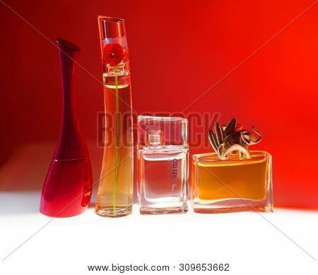 Prague, Czech Republic- January 22, 2019. Perfume KENZO bottle on red background.  Kenzo Flower Perfume