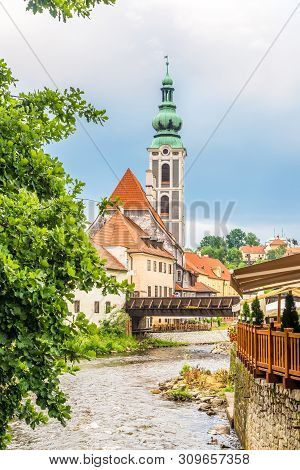 View At The Embankment Of Vltava River With St.jost Church In Cesky Krumlov - Czech Republic