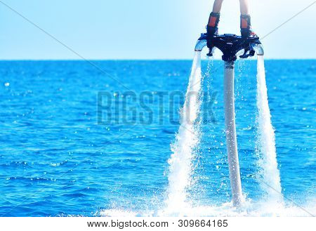 Flyboarding And Seariding In A Blue Sea