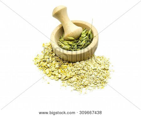 Fresh Self-made Oats With Wooden Morter On White