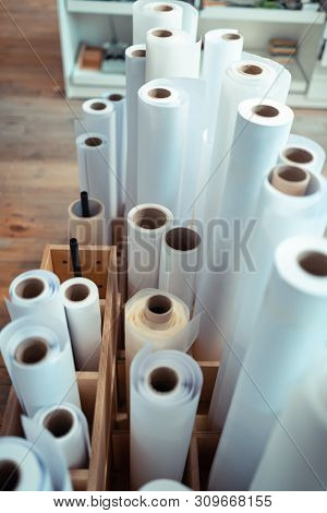 Paper Rolls For Manufacturing Books Standing In The Wooden Box