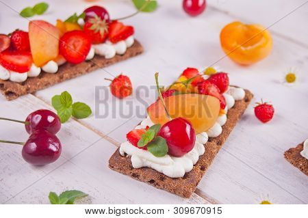 Crisp Bread With Creme Cheese, Fruit And Berries