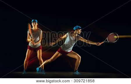 One Caucasian Woman Playing Tennis Isolated On Black Background In Mixed And Stobe Light. Fit Young 
