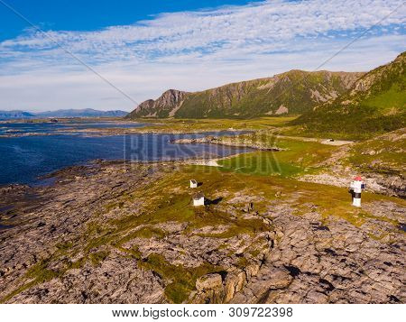 Seascape With Lighthouse, Rest Stop Location On Andoya Island. Scenic Rocky Coastline Near Nordmela 