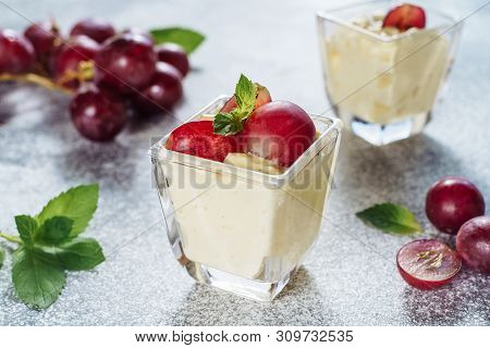 Italian Panakota Cool Sweet Dessert Grape Berry. Traditional Cold Dish Cream Cheese With Ripe Fruit 