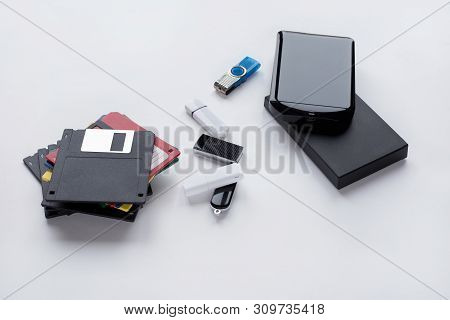 The Evolution Of Digital Devices For The Transfer And Storage Of Information. Objects Isolated On Wh