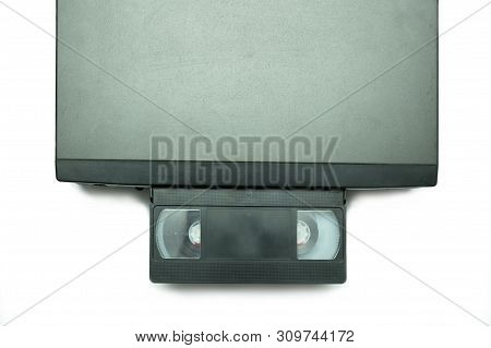 Old Vhs Video Cassettes On Old Video Recorder Isolated On White Background.