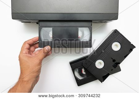 High Angle Shot On Video Tape Inserted In Vcr. Cctv Tape Recorder. Black Video Cassette Vhs Type Loa