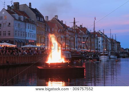 Copenhagen, Zealand Denmark - June 23 2019: Burning The Witch On Bonfire The Middle Of Nyhavn Canal 