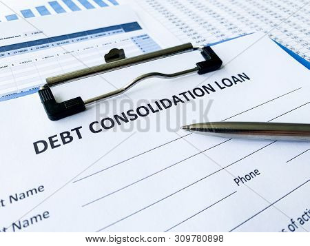 Debt Consolidation Loan Document With Graph On Table.