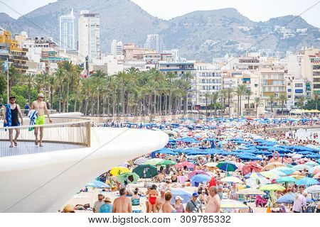 Benidorm, Spain, 16 June, 2019: View Of Benidorm Poniente Beach Full Of Resting People In Benidorm, 