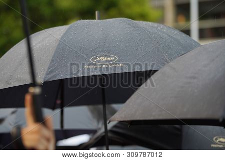 CANNES, FRANCE - MAY 18, 2019: Rain and umbrella details during red carpet of 