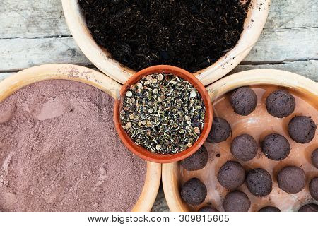 Ingredients For Making Seed Bombs On A Wooden Background
