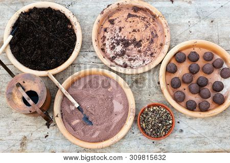 Ingredients For Making Seed Bombs On A Wooden Background