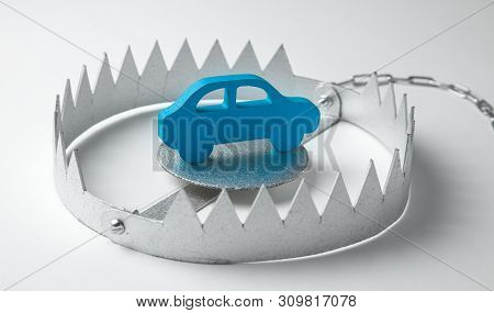 Trap With Bait Car. The Risk Of Buying Bad Car. Car Insurance. Gray Background