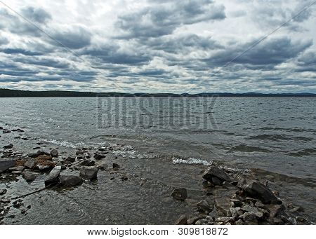 Heavy Gray Clouds Over The Lake On A Cloudy Evening, The Southern Urals, Lake Uvildy