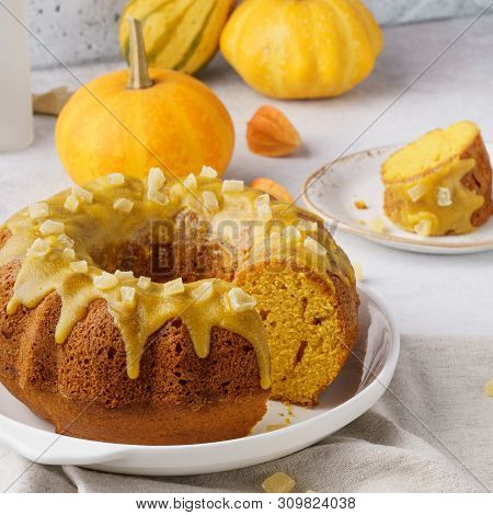A Piece Of Sweet Pumpkin Bundt Cake Topped With Sugar Glaze.