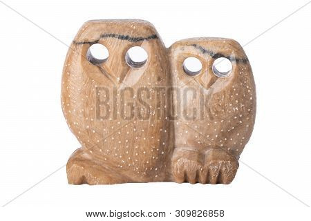 Owls Isolated. Two Owls Handmade Of Soapstone With Holes As Eyes Isolated On White Background.