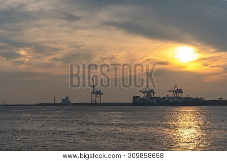 Osaka Bay With Yumeshima Island On Background In Summer Sun Set Time, View From Osaka Metro Cosmosqu