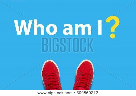 Legs In Red Sneakers Standing On A Blue Background With The Text Who Am I. Concept Of Self-developme