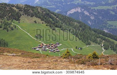 View Of The Village Obermutten. Early Summer In The Swiss Alps.