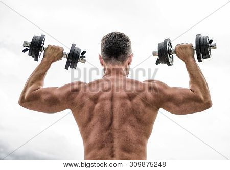 Man Sportsman Weightlifting. Steroids. Fitness And Sport Equipment. Muscular Back Man Exercising In 