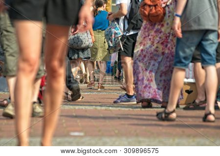 People At A Weekend Flea Market On The Streets With Blurred Background
