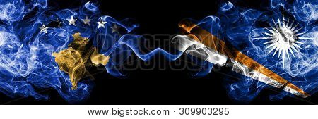 Kosovo Vs Marshall Islands Smoky Mystic Flags Placed Side By Side. Thick Colored Silky Smokes Combin
