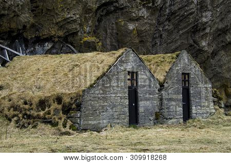 Old Stone House Destroyed Ancient Viking Overgrown With Yellow Dry Grass In Iceland