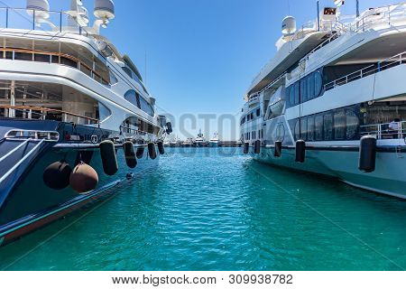 Marina Zeas In Piraeus, Greece. Ferryboats Moored At Harbor Ready To Sail. Blue Sky And Sea Backgrou