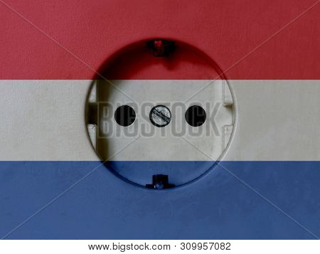 Electricity Concept: Dirty Type F Power Socket With Netherlands Flag