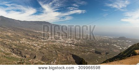 Aerial View Of Guimar Valley On A Bright Sunny Day. The Eastern End Of The Island Disappears In A Li