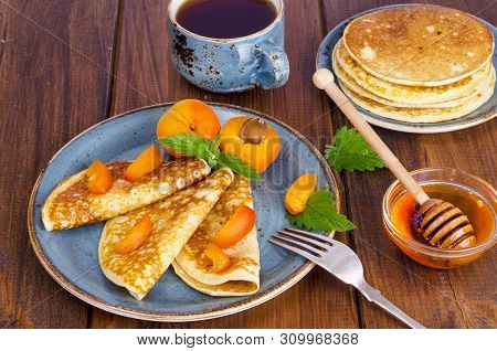 Wheat Pancakes With Honey And Apricots. Photo