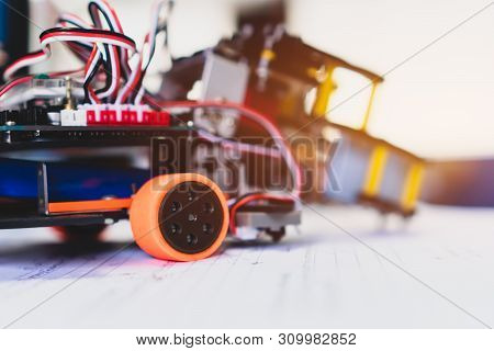 Robotics Technology And Stem Education Class Concept :  Metal Robot And Electronic Board Robots With