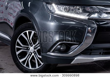 Novosibirsk, Russia - June 28, 2019:  Mitsubishi Outlander, Close-up Of The Headlight, Bumper, Wheel