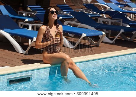 Image Of Beautiful Woman Relaxing In Swimming Pool. Girl With Healthy Tanned Skin, Gorgeous Female E