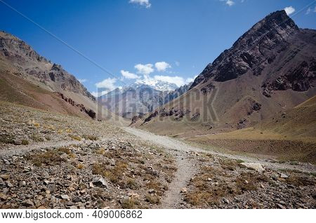 Andes Mountains Landscape With Hiking Trail With No People. Arid Climate Desert And Rocky Mountains.