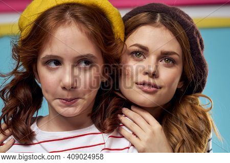 Mom And Daughter Striped T-shirts Hugs Fun Lifestyle Blue Background
