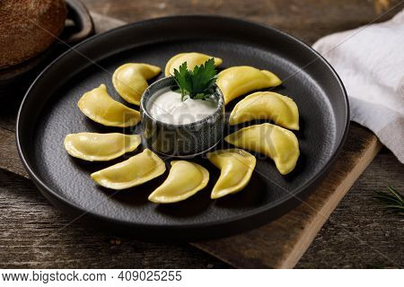 Appetizing Traditional Russian Dumplings Made By Hand With Delicious Filling. Still Life On A Wooden