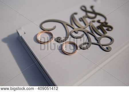 A Mr And Mrs Lettering With Wedding Rings