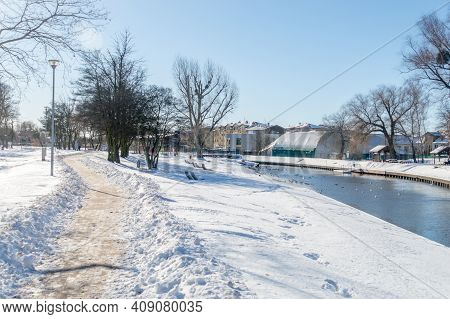 Snowy View On Pathway On Radunia River In Pruszcz Gdanski, Poland.