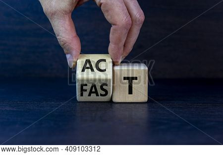 Time To Act Fast Symbol. Businessman Turns A Wooden Cube With Words 'act Fast'. Beautiful Grey Backg