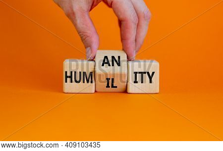 Humility Vs Humanity Symbol. Businessman Turns Cubes And Changes The Word 'humility' To 'humanity'. 