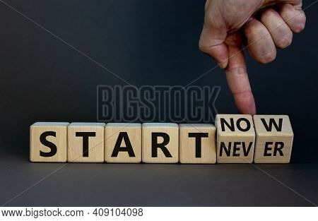 Start Now Or Never Symbol. Businessman Turns Wooden Cubes And Changes Words 'start Never' To 'start 