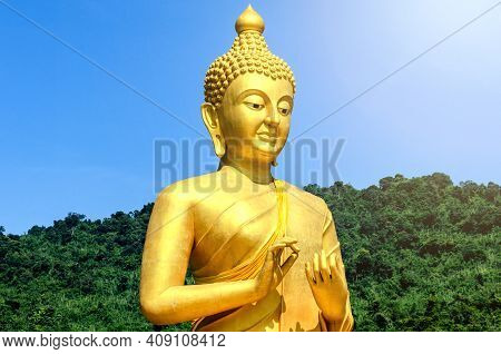 Magha Asanha Visakha Puja Day. Golden Buddha On Natural Background.