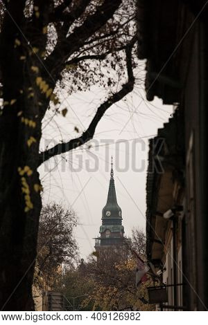 Close Up On The Clock Tower Of The Subotica City Hall, In Serbia, At Sunset. Also Called Gradska Kuc