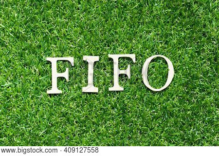 Alphabet Letter In Word Fifo (abbreviation Of First In First Out) On Green Grass Background