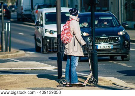 Reims France February 20, 2021 People Rolling With An Electric Scooter In The Streets Of Reims, Oper