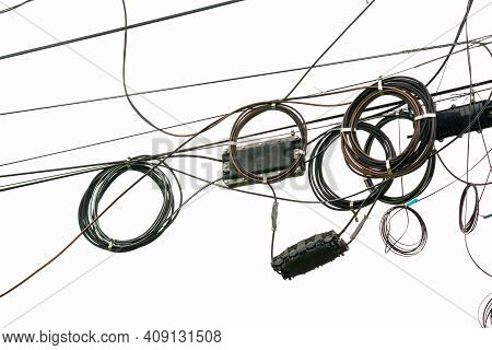 Cable Wires On The Electric Poles Are Tangled On White  Background , Bangkok Thailand.